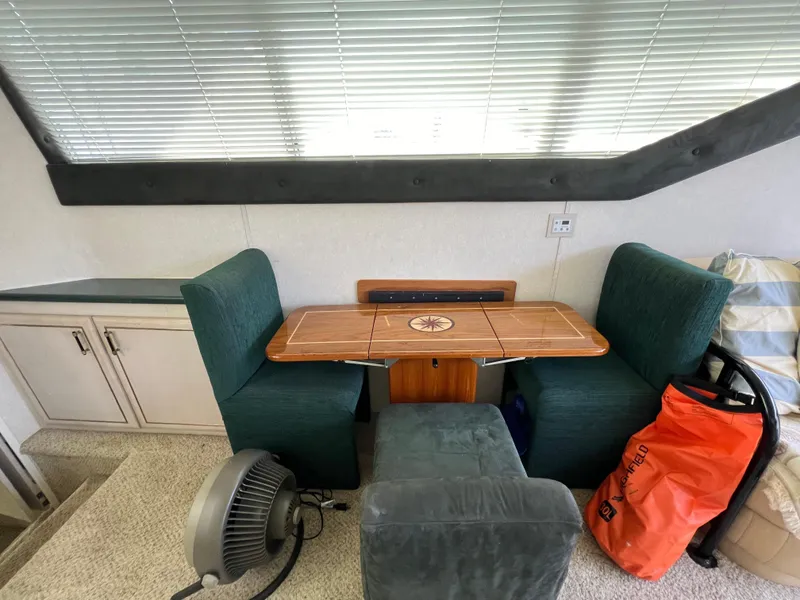 Slide: The Image of Interior of 1998 Mainship 47 Motor Yacht with dining area and seating. - 49