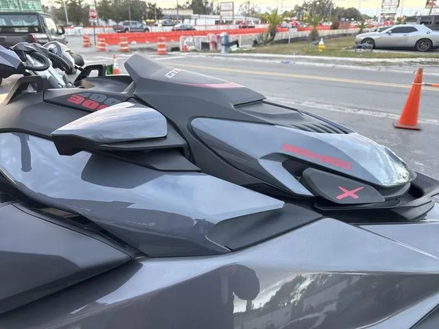 Slide: The Image of 2024 Sea-Doo Waverunner PWC GTR X 300 on trailer, parked outdoors. - 4