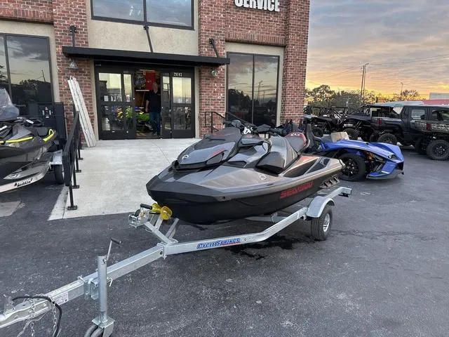 Slide: The Image of 2024 Sea-Doo Waverunner PWC GTR X 300 on trailer outside service center. - 8