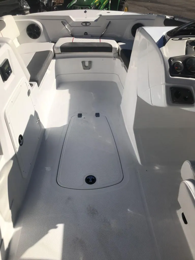 Slide: The Image of 2024 Tahoe 1950 boat interior with seating and storage compartments. - 11