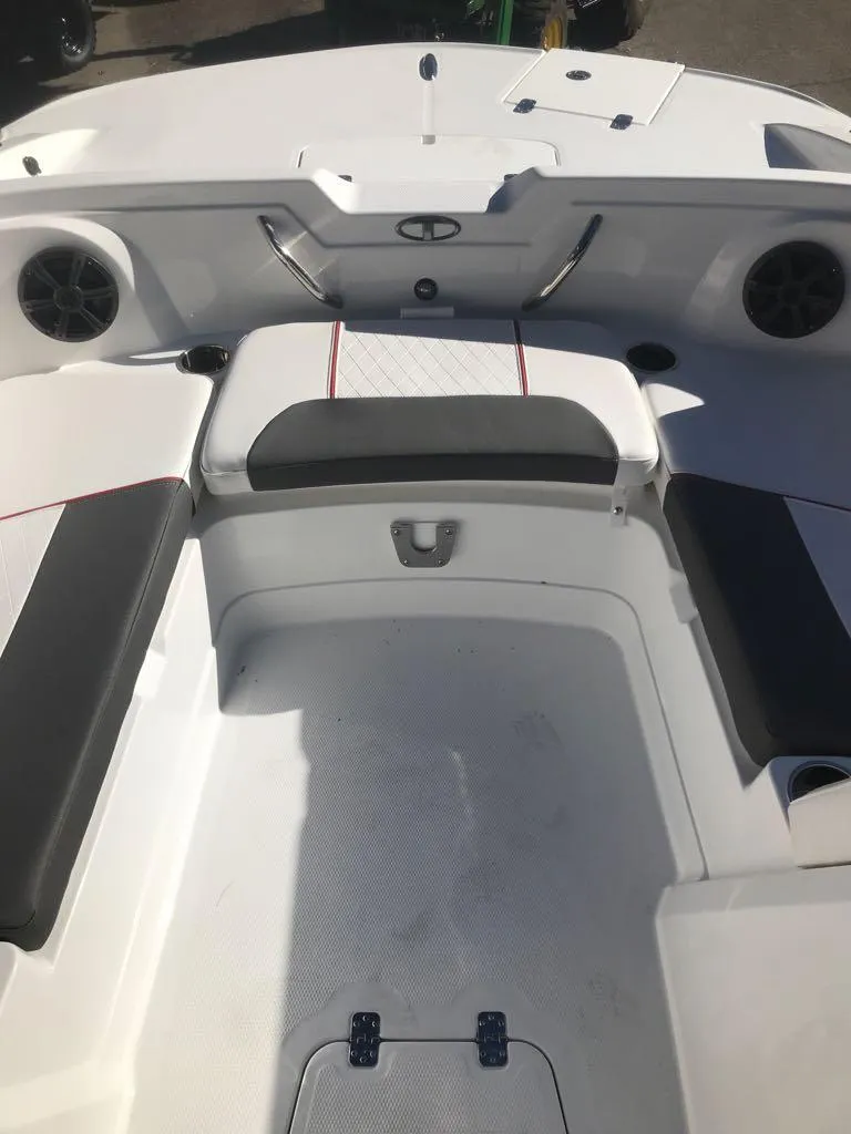 Slide: The Image of 2024 Tahoe 1950 boat interior with seating and speakers. - 15