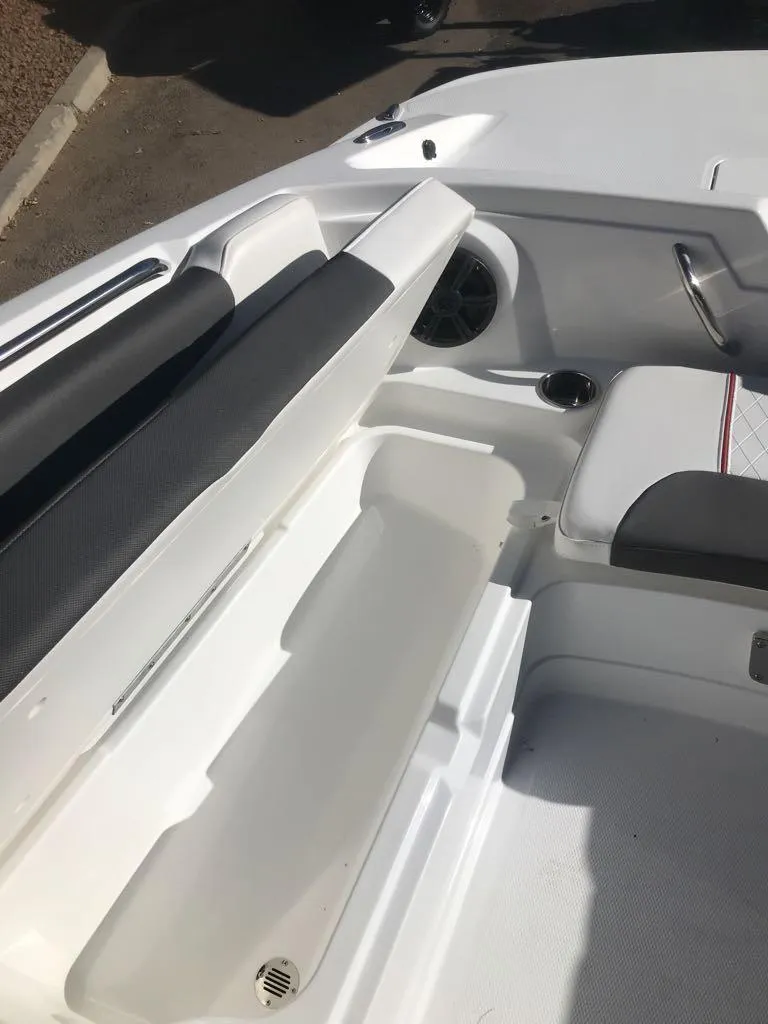 Slide: The Image of 2024 Tahoe 1950 boat interior with seating and storage compartment. - 16