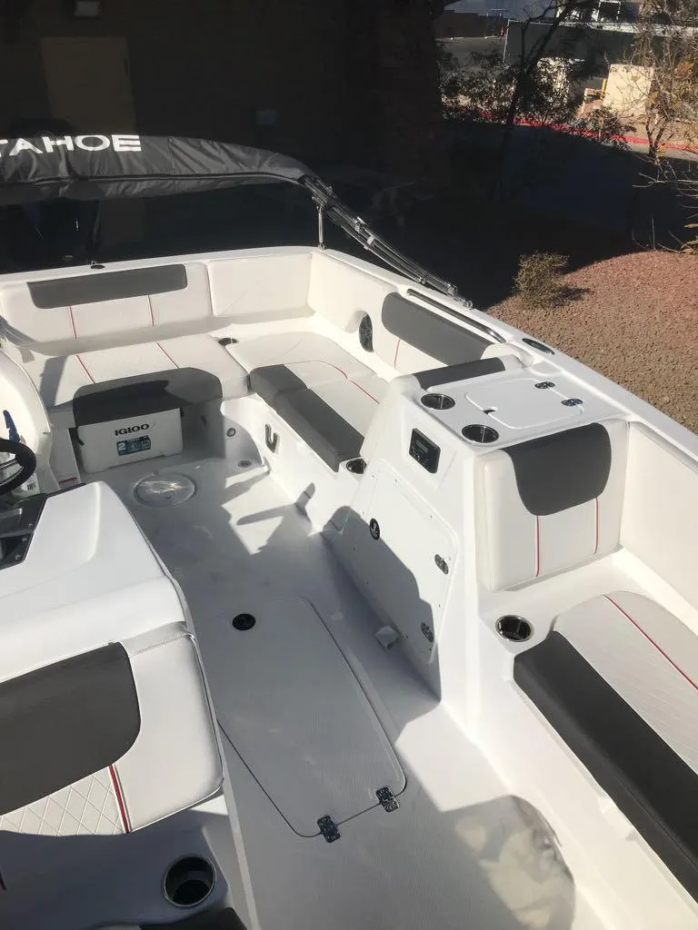 Slide: The Image of 2024 Tahoe 1950 boat interior with seating and storage compartments. - 18