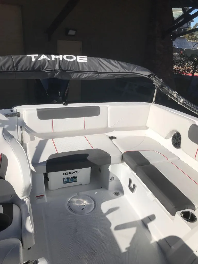 Slide: The Image of 2024 Tahoe 1950 boat interior with seating and storage. - 19
