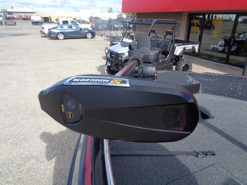 Slide: The Image of 2024 Nitro ZV21 boat with Minn Kota trolling motor in parking lot. - 10