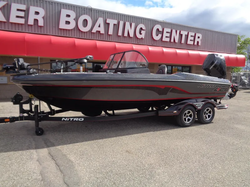 Slide: The Image of 2024 Nitro ZV21 boat displayed outside a boating center. - 2