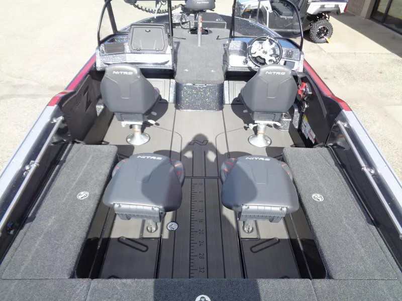 Slide: The Image of 2024 Nitro ZV21 fishing boat interior with four seats and a spacious deck. - 5
