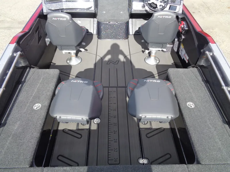 Slide: The Image of 2024 Nitro ZV21 boat interior with four seats and a measuring ruler on the floor. - 6
