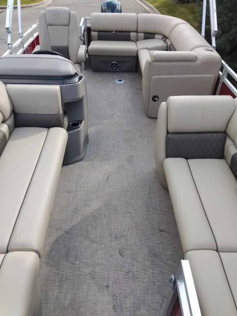 Slide: The Image of 2024 Sun Tracker Party Barge 20 DLX interior with spacious seating and modern design. - 11