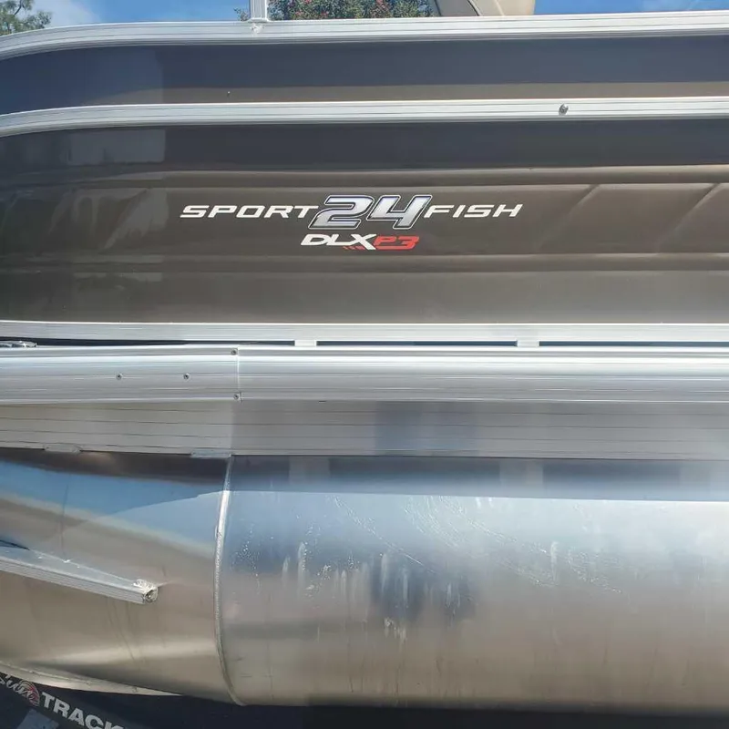 Slide: The Image of 2024 Sun Tracker Sportfish 24 XP3 pontoon boat side view. - 4