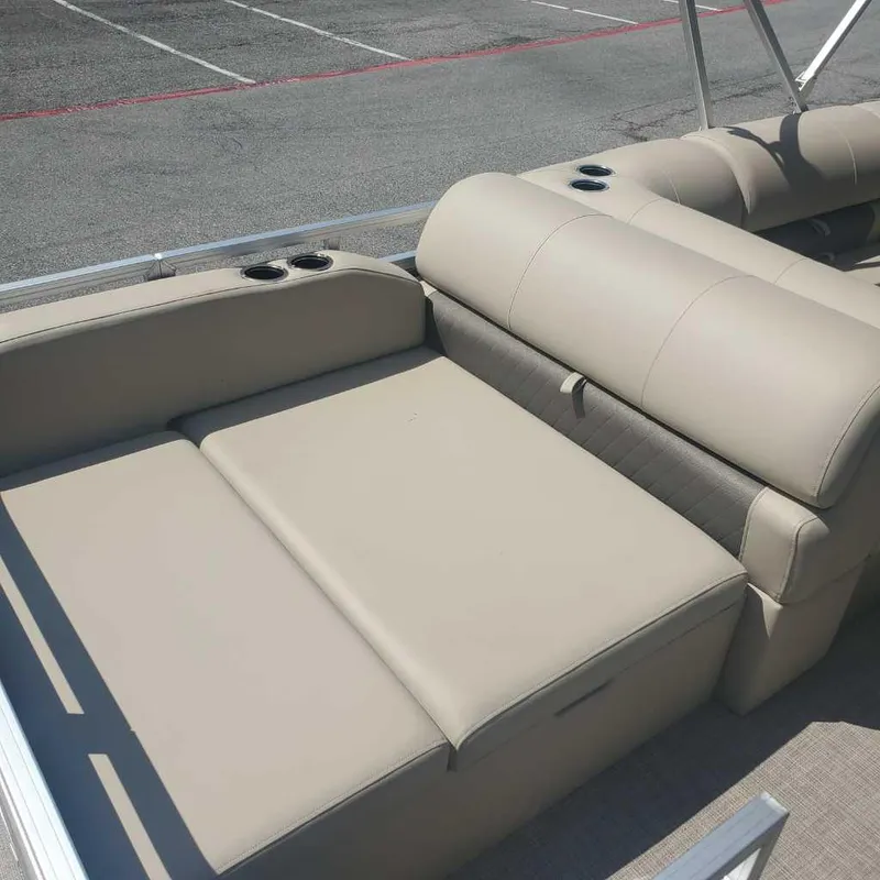 Slide: The Image of 2024 Sun Tracker Sportfish 24 XP3 boat interior seating area. - 8