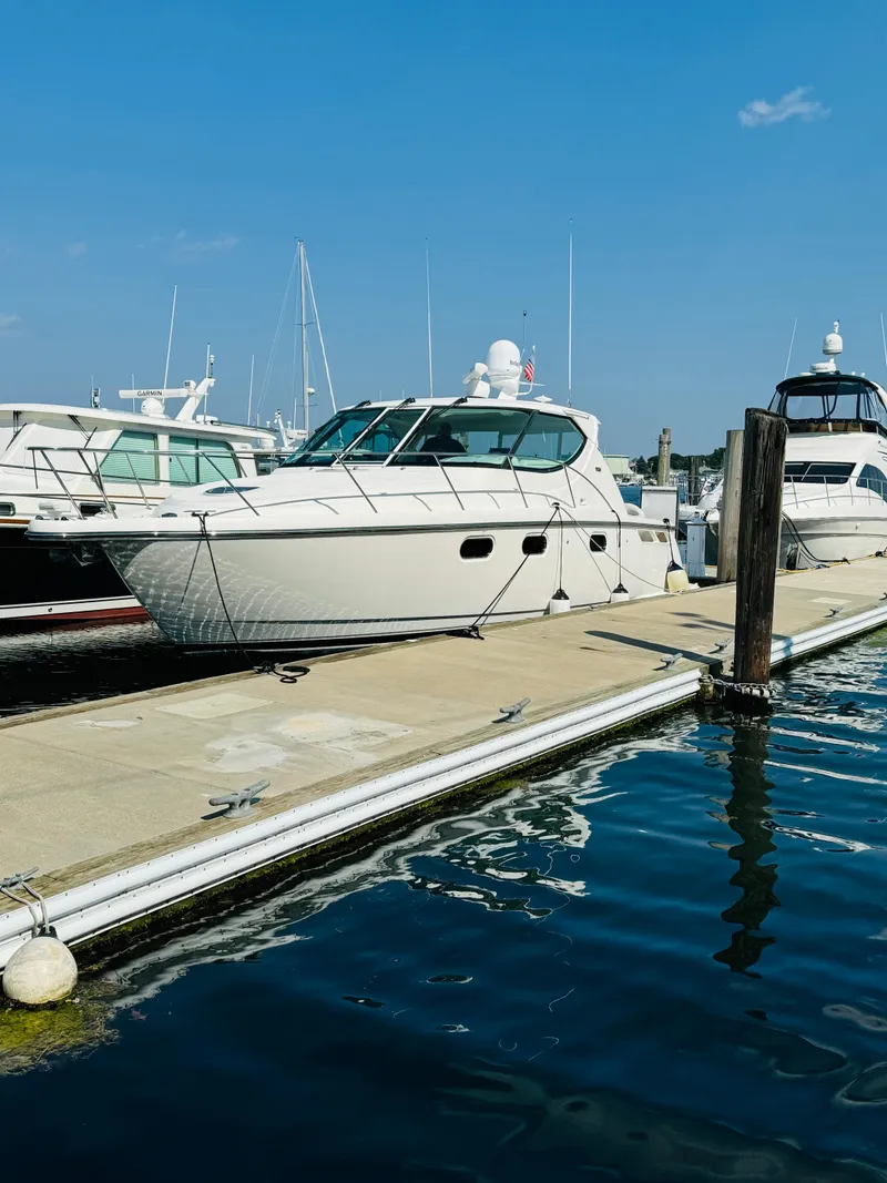 Slide: The Image of 2007 Tiara Yachts 3900 Sovran docked at a marina on a sunny day. - 0