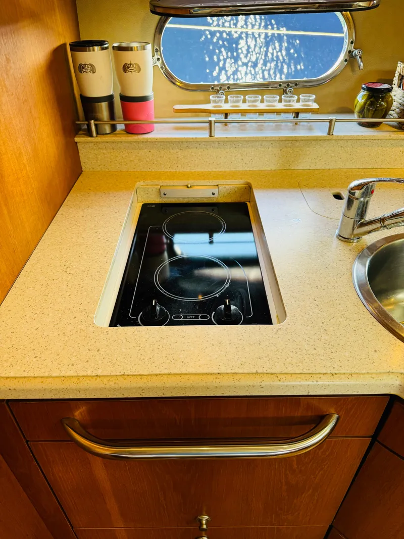 Slide: The Image of 2007 Tiara Yachts 3900 Sovran kitchen with electric stove and sink. - 13
