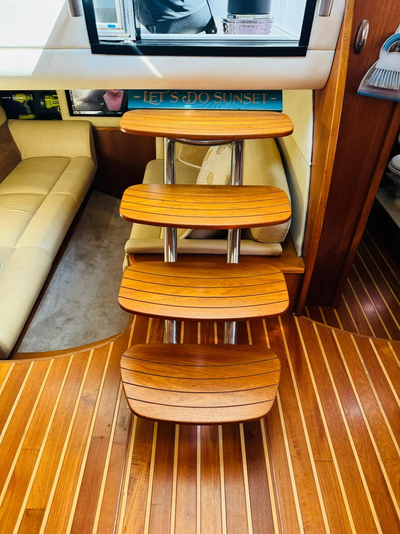 Slide: The Image of Wooden steps inside a 2007 Tiara Yachts 3900 Sovran, leading to a cozy cabin. - 19