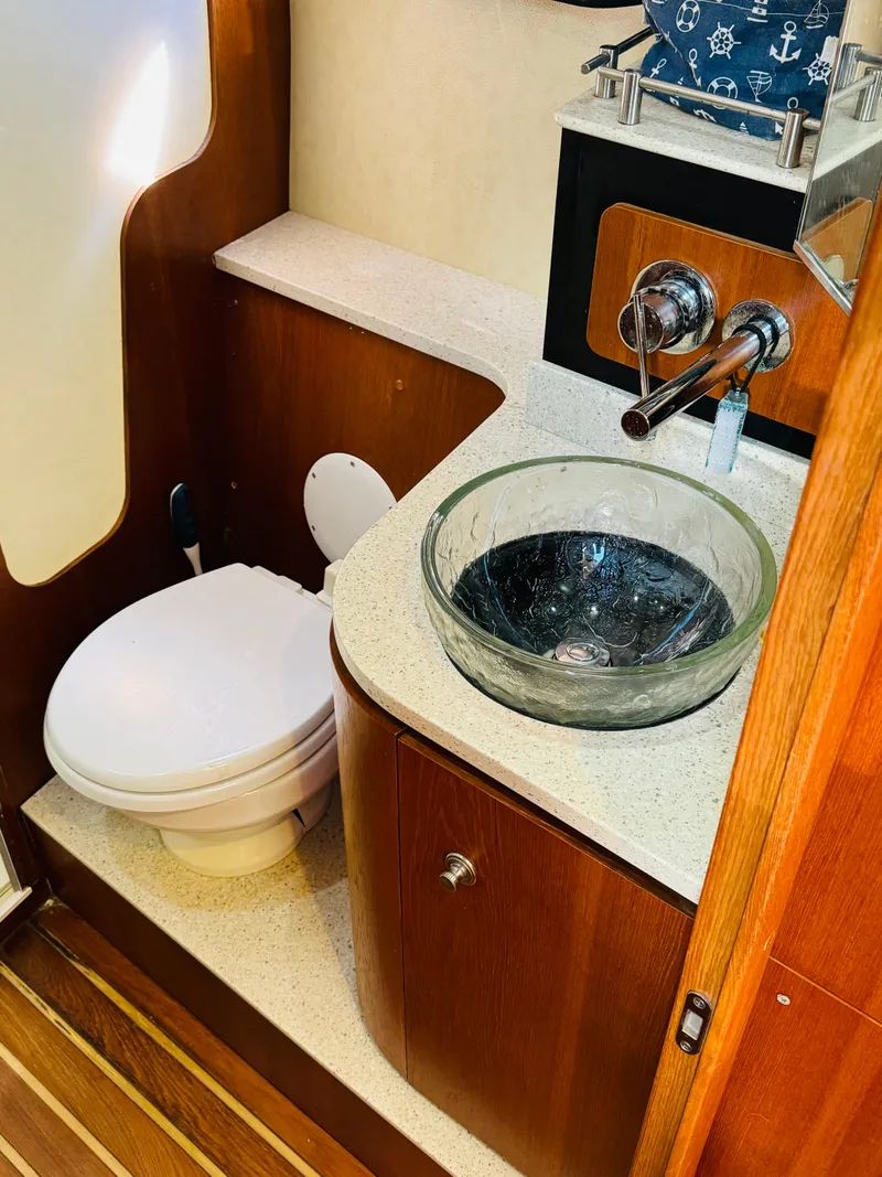 Slide: The Image of 2007 Tiara Yachts 3900 Sovran bathroom with modern sink and toilet. - 20