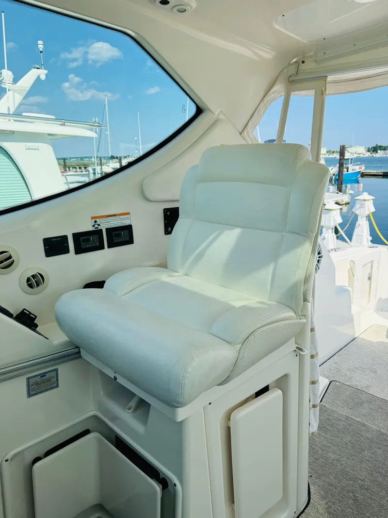 Slide: The Image of Captain's chair on a 2007 Tiara Yachts 3900 Sovran, docked at a marina. - 28