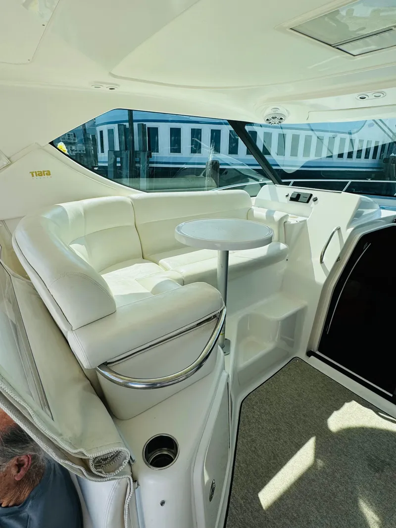 Slide: The Image of 2007 Tiara Yachts 3900 Sovran interior with white seating and table. - 29