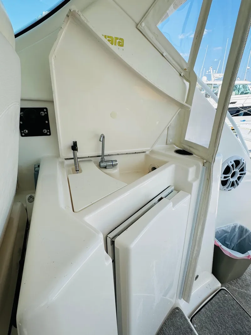 Slide: The Image of 2007 Tiara Yachts 3900 Sovran sink and storage area on deck. - 31