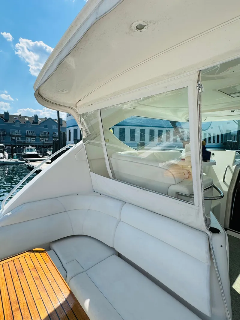 Slide: The Image of 2007 Tiara Yachts 3900 Sovran with white seating and wooden deck. - 35