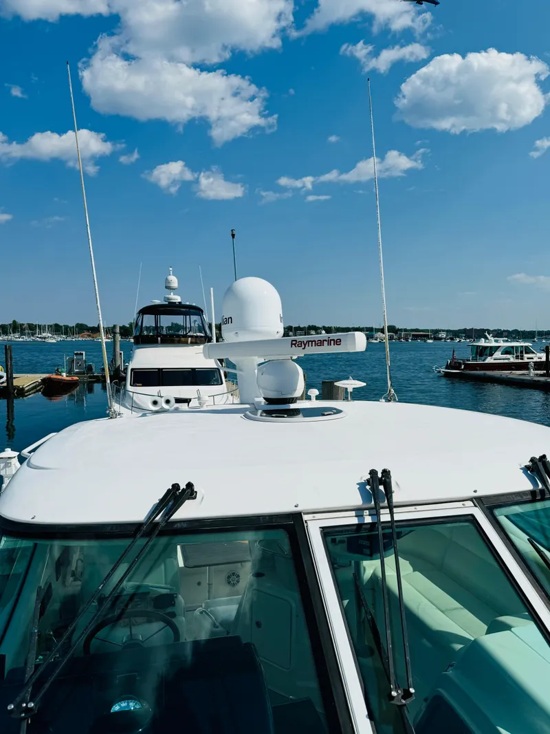 Slide: The Image of 2007 Tiara Yachts 3900 Sovran docked at a marina on a sunny day. - 37