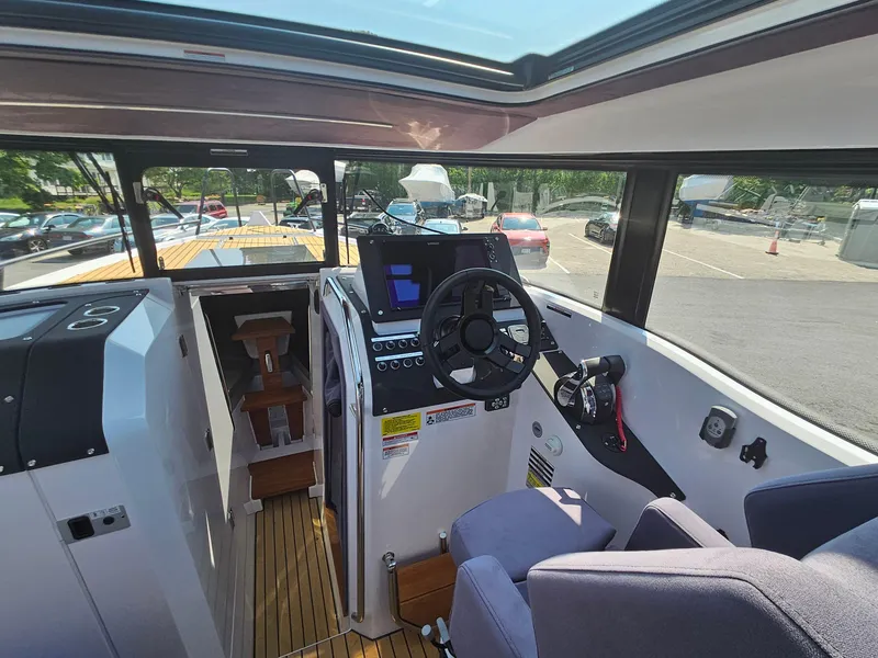 Slide: The Image of Interior cockpit of 2023 XO Boats EXPLR 10 Sport Plus with modern controls and seating. - 14