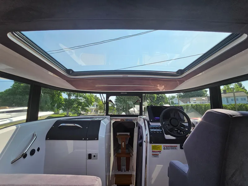 Slide: The Image of Interior view of 2023 XO Boats EXPLR 10 Sport Plus with panoramic sunroof. - 21