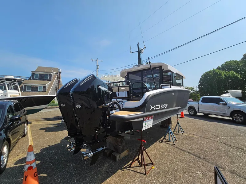 Slide: The Image of 2023 XO Boats EXPLR 10 Sport Plus with twin Mercury engines on display. - 8