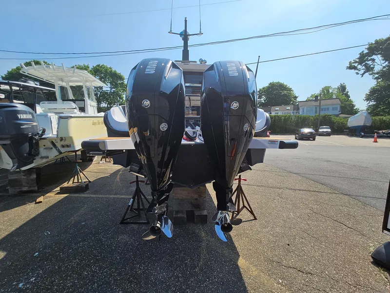 Slide: The Image of 2023 XO Boats EXPLR 10 Sport Plus with dual outboard engines. - 9