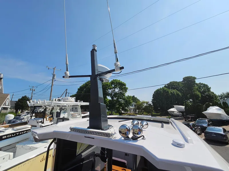 Slide: The Image of 2023 XO Boats EXPLR 10 Sport Plus with advanced antenna system and spotlights. - 17