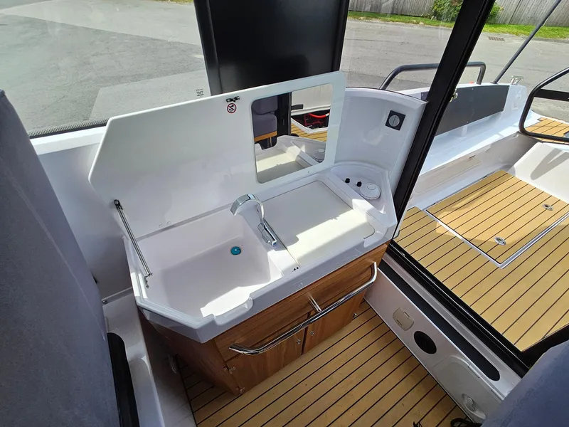 Slide: The Image of 2023 XO Boats EXPLR 10 Sport Plus interior sink and counter area. - 24