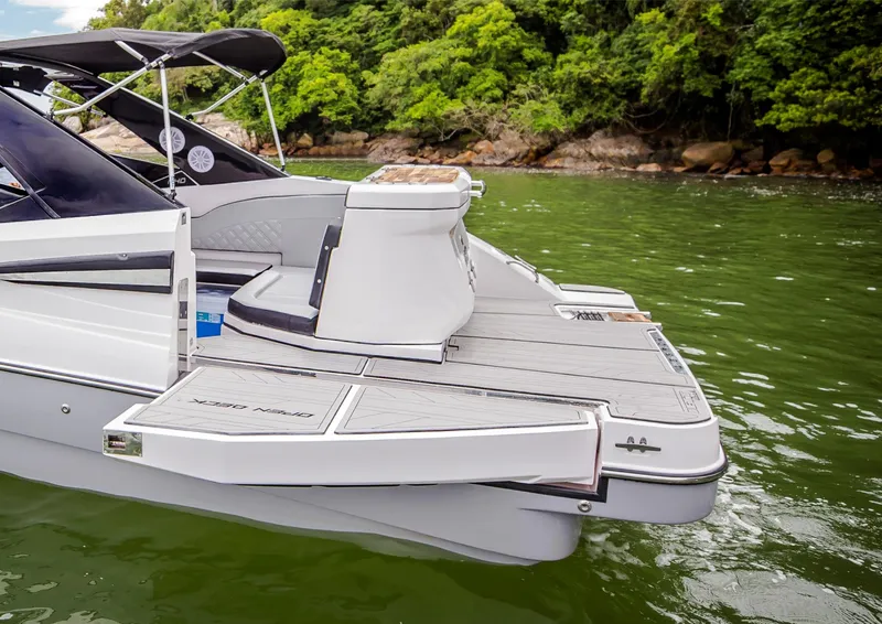 Slide: The Image of 2025 NHD 255 Open Deck boat with swim platform on a lake. - 5