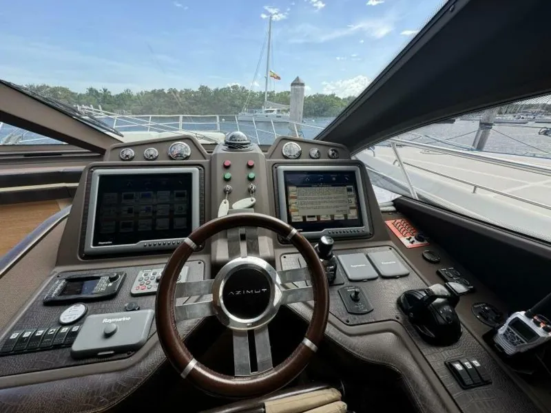 Slide: The Image of Cockpit of a 2013 Azimut 64 Fly yacht with advanced navigation systems. - 12