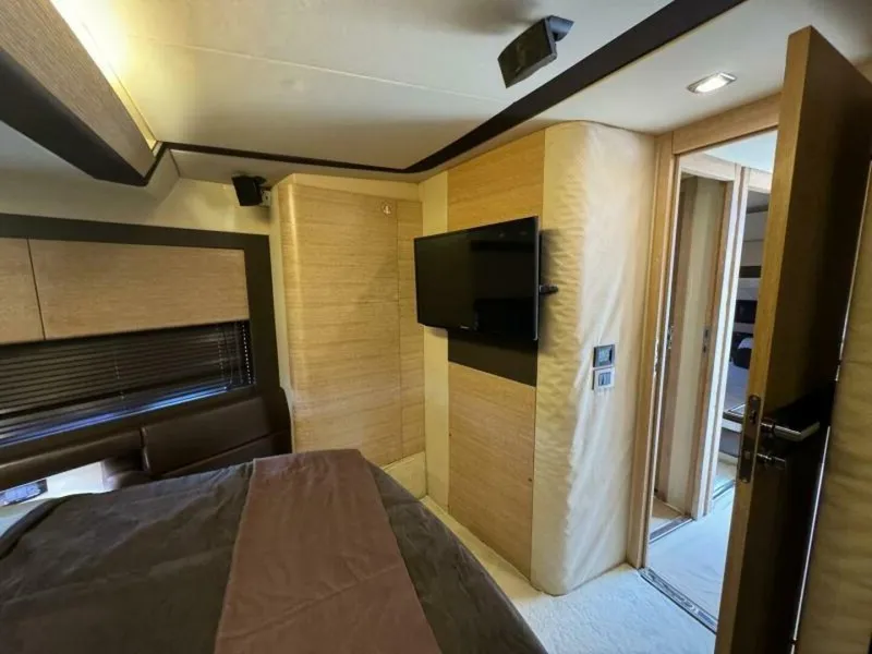 Slide: The Image of Interior of 2013 Azimut 64 Fly yacht bedroom with TV and modern decor. - 18