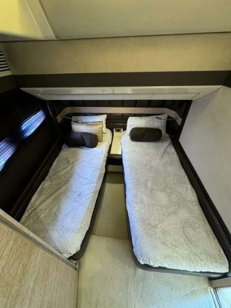 Slide: The Image of Twin beds in the 2013 Azimut 64 Fly yacht cabin. - 20