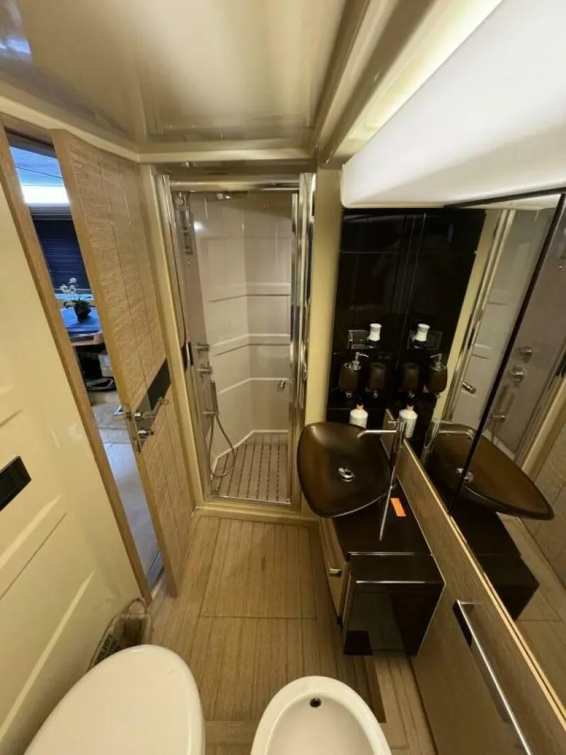 Slide: The Image of Luxurious bathroom in a 2013 Azimut 64 Fly yacht with modern fixtures and shower. - 25