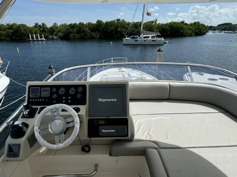 Slide: The Image of 2013 Azimut 64 Fly yacht helm station with Raymarine navigation system. - 26