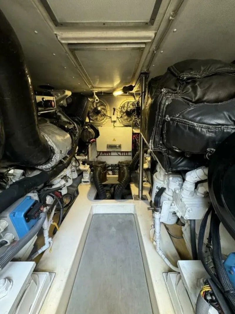 Slide: The Image of Engine room of a 2013 Azimut 64 Fly yacht, showcasing mechanical components. - 34