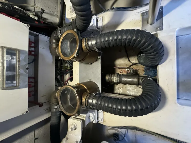 Slide: The Image of Engine room of a 2013 Azimut 64 Fly yacht showing hoses and mechanical components. - 37