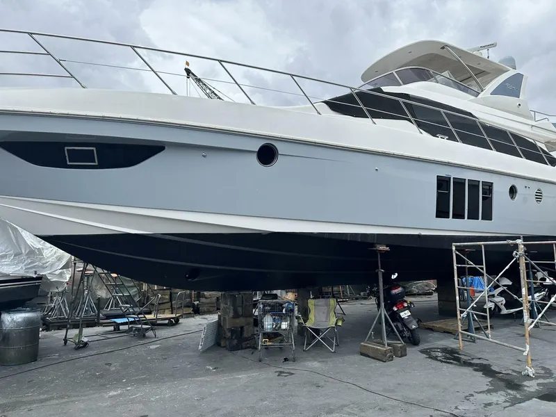 Slide: The Image of 2013 Azimut 64 Fly yacht in dry dock for maintenance. - 40