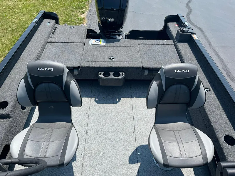 Slide: The Image of 2025 Lund 1675 Adventure Sport boat interior with two grey seats. - 10