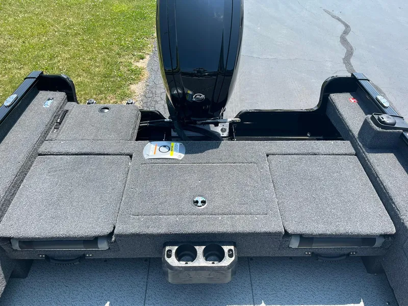 Slide: The Image of 2025 Lund 1675 Adventure Sport boat interior with motor and storage compartments. - 11