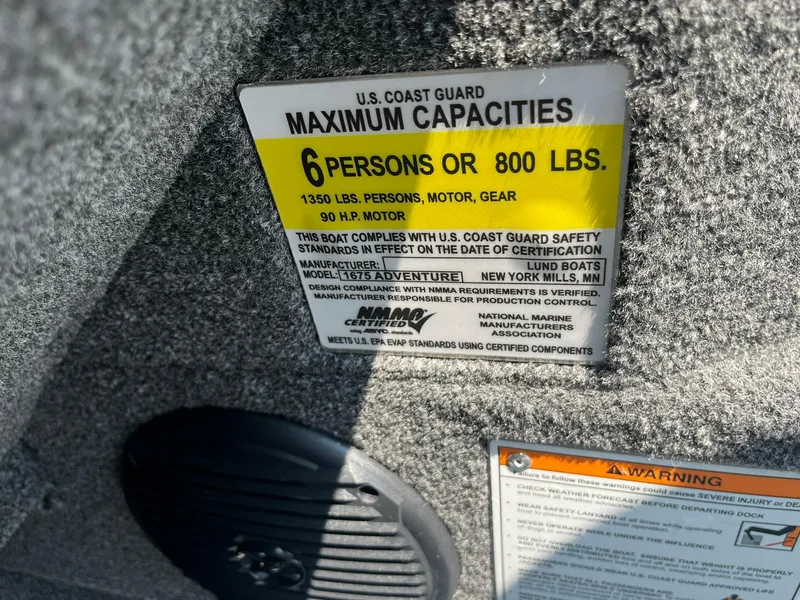 Slide: The Image of 2025 Lund 1675 Adventure Sport boat capacity label, U.S. Coast Guard maximum capacities, 6 persons or 800 lbs. - 20