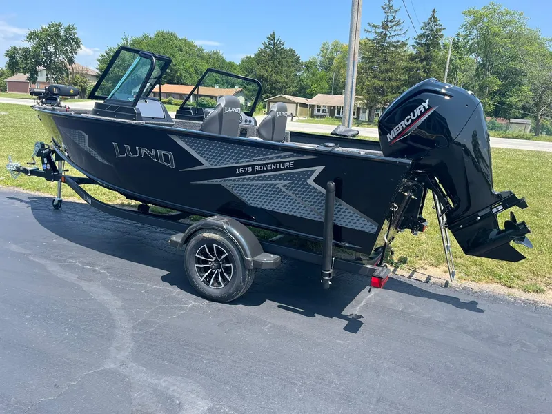 Slide: The Image of 2025 Lund 1675 Adventure Sport boat with Mercury outboard motor on trailer. - 3