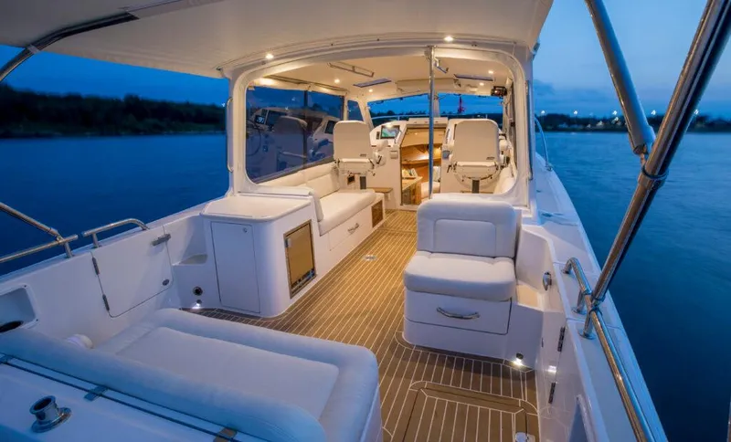 Slide: The Image of Luxurious interior of the 2025 MJM 35 yacht at dusk on the water. - 10