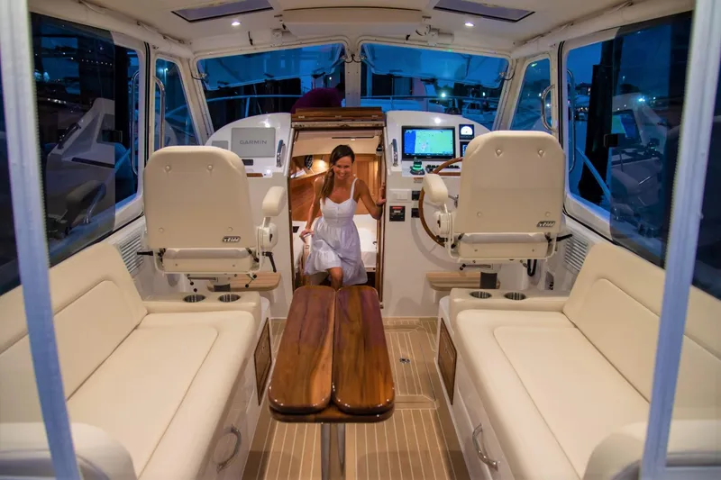 Slide: The Image of Interior of 2025 MJM 35 boat with woman in white dress. - 13