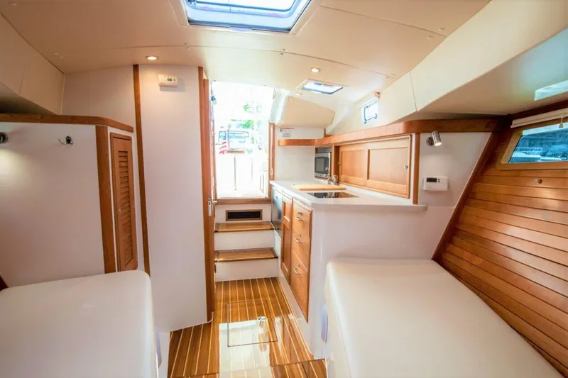 Slide: The Image of Modern interior of MJM 35 yacht, 2025 model, featuring wood accents and natural light. - 16