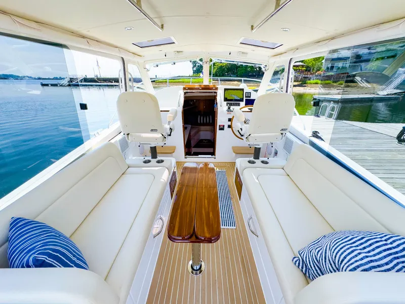 Slide: The Image of Luxurious interior of 2025 MJM 35 yacht with plush seating and wooden table. - 27