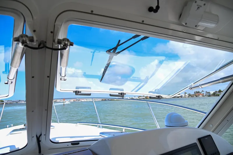 Slide: The Image of View from the helm of a 2025 MJM 35 boat, overlooking the water. - 33