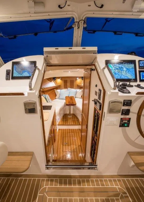 Slide: The Image of Interior of 2025 MJM 35 boat with modern navigation equipment and cozy cabin. - 36