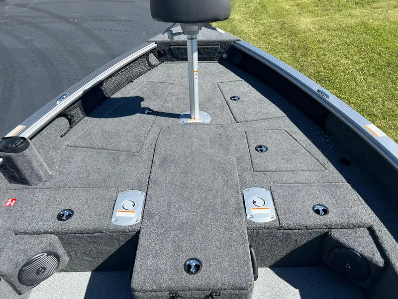 Slide: The Image of 2025 Lund 1875 Pro Guide boat interior with gray carpet and seating. - 10